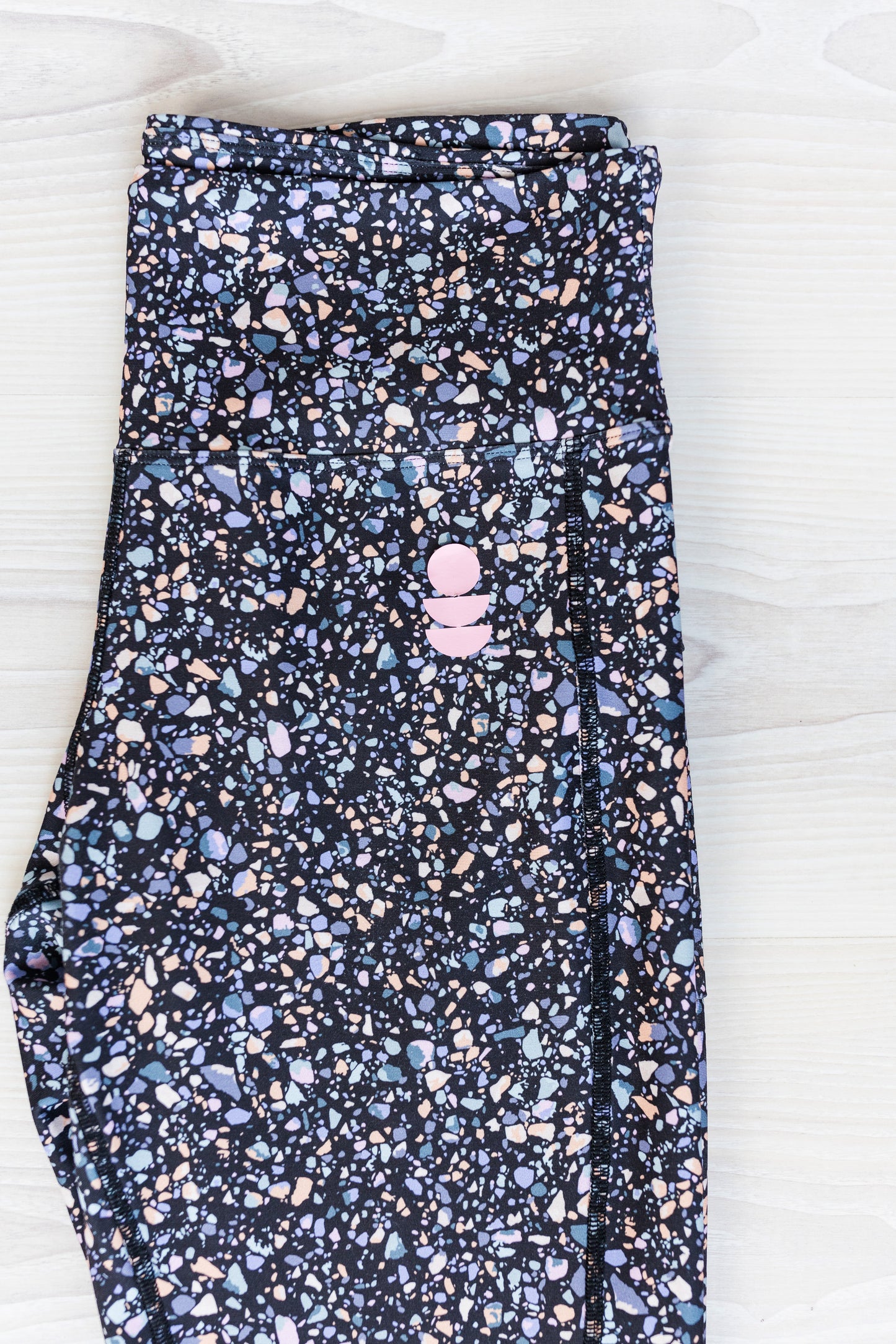 black terrazzo legging close up of the print colours 