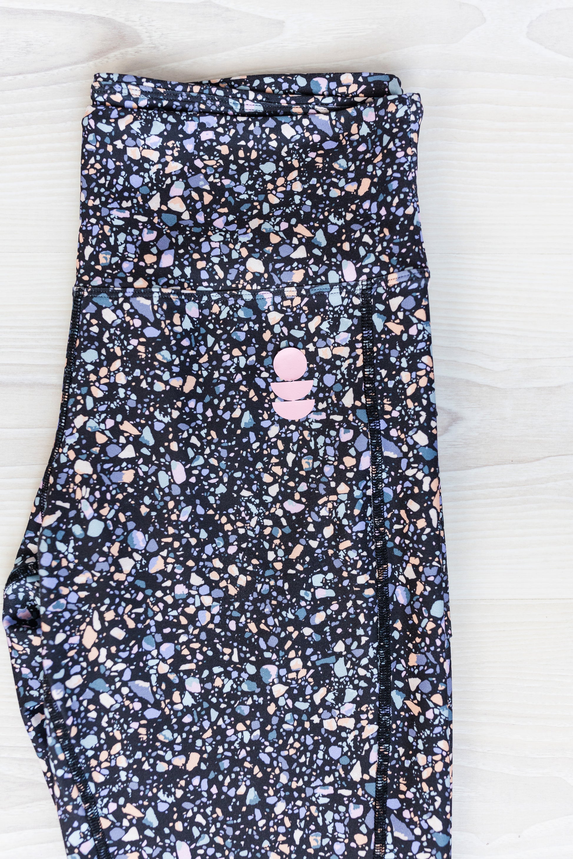 black terrazzo legging close up of the print colours 