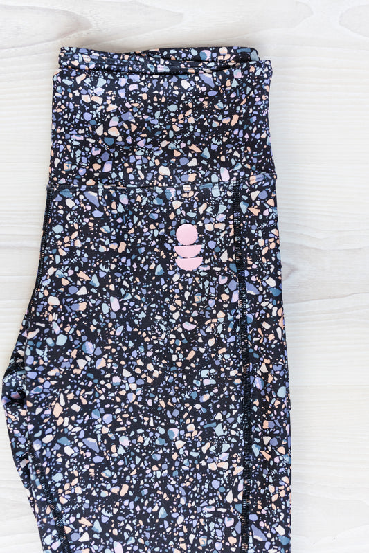 black terrazzo legging close up of the print colours 